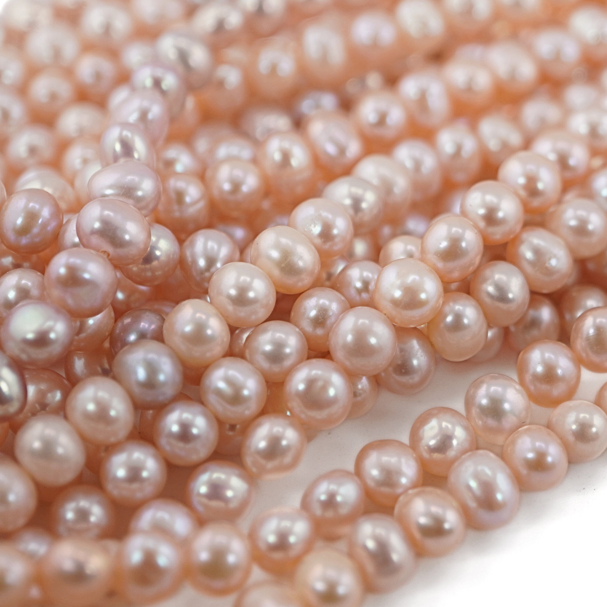 handcrafted jewelry with peach potato pearls

