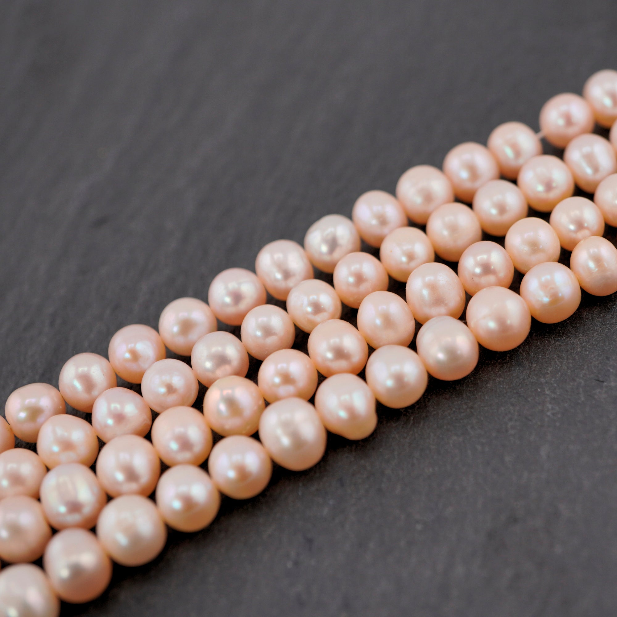 oval shaped peach pearl beads

