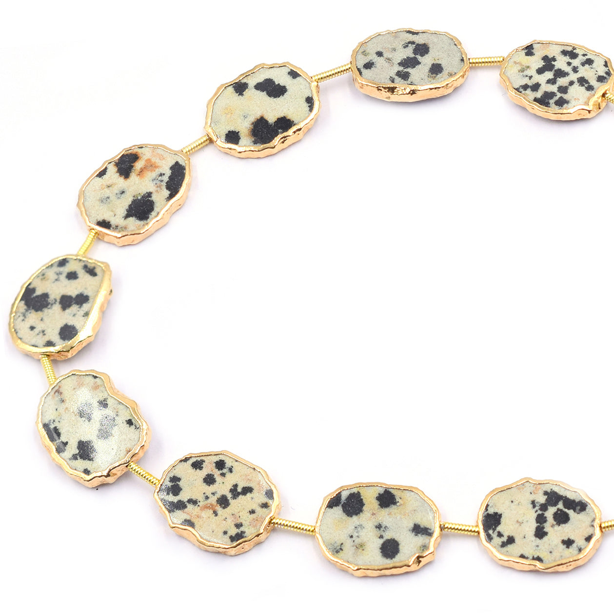 Uneven shaped Dalmatian Jasper pendant with gold finish