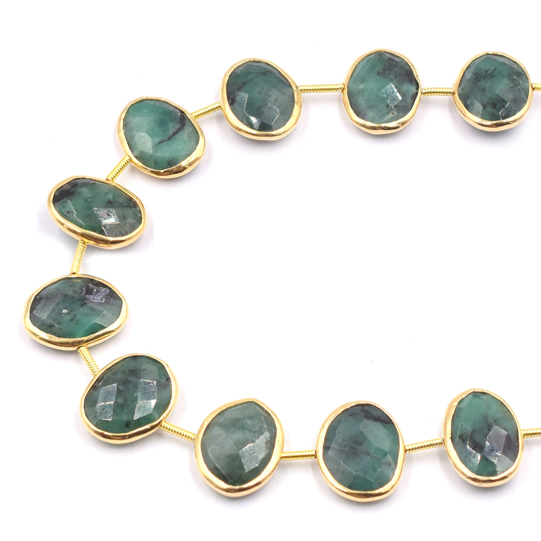 Oval shaped raw emeralds in vermeil finish