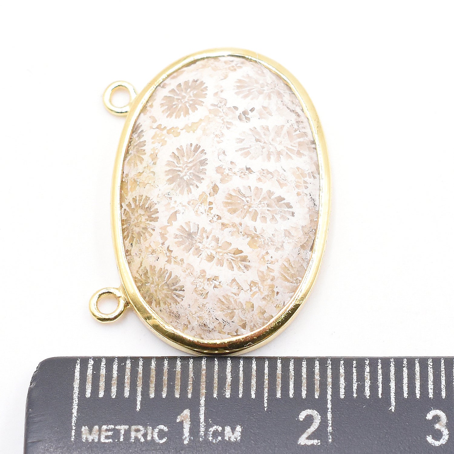 Fossil coral oval pendant with silver bezel