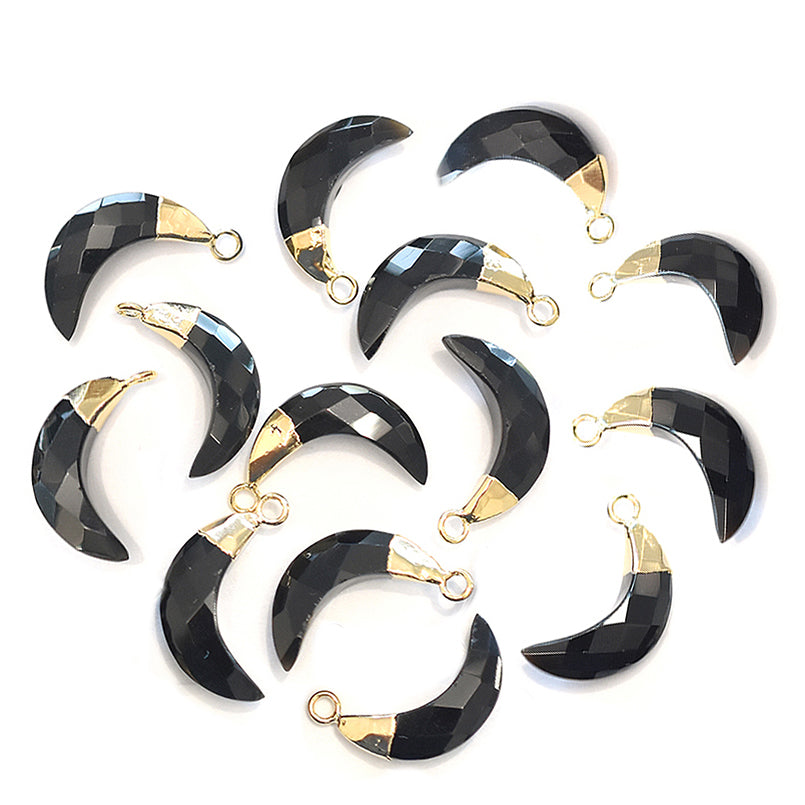 Polished black onyx stone in an Moon shape with a gold plated finish