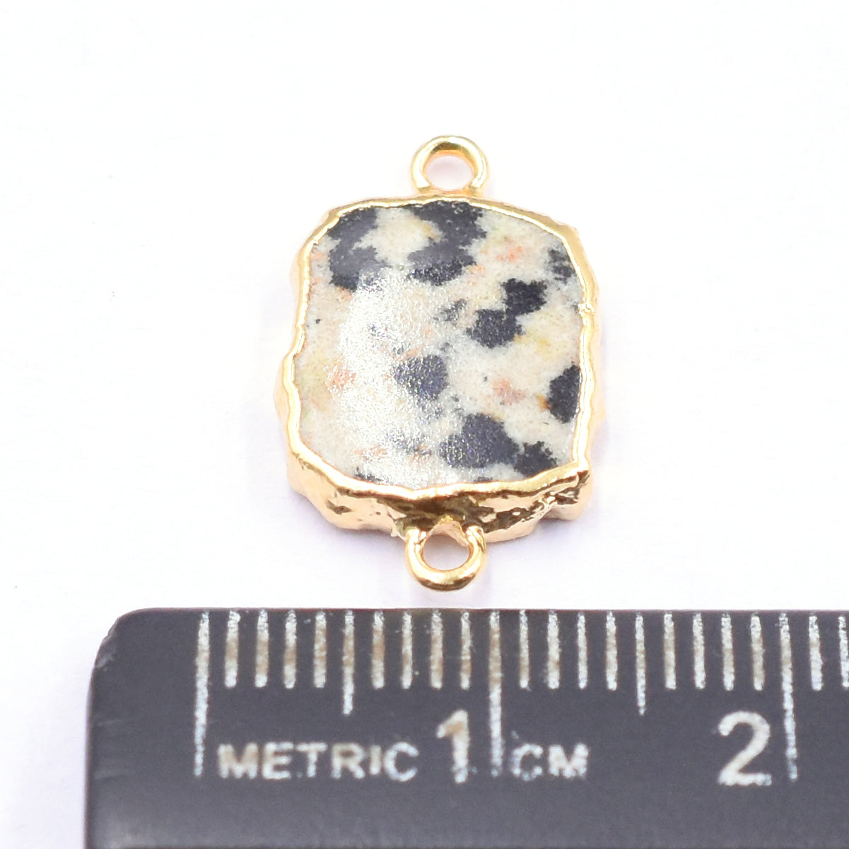 Stylish Rectangle shaped Dalmatian Jasper pendant with gold detail