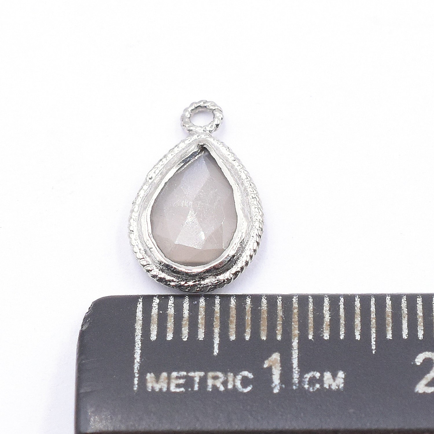 Gray Moonstone 9X7 MM Pear Shape Twisted Wire Silver Bezel Rhodium Plated Pendant (Set Of 2 Pcs) - Jaipur Gem Factory