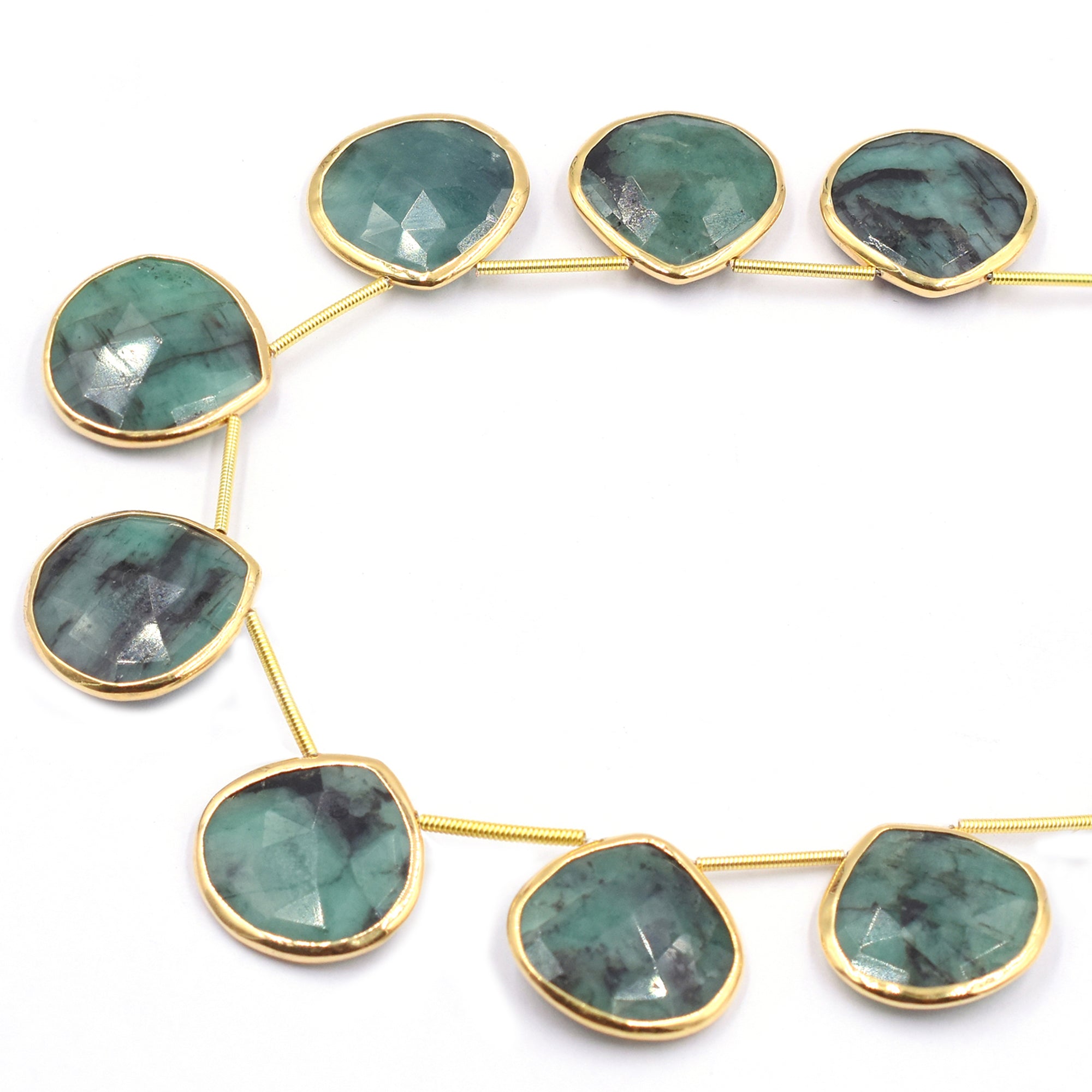 Heart-shaped raw emerald set in silver vermeil