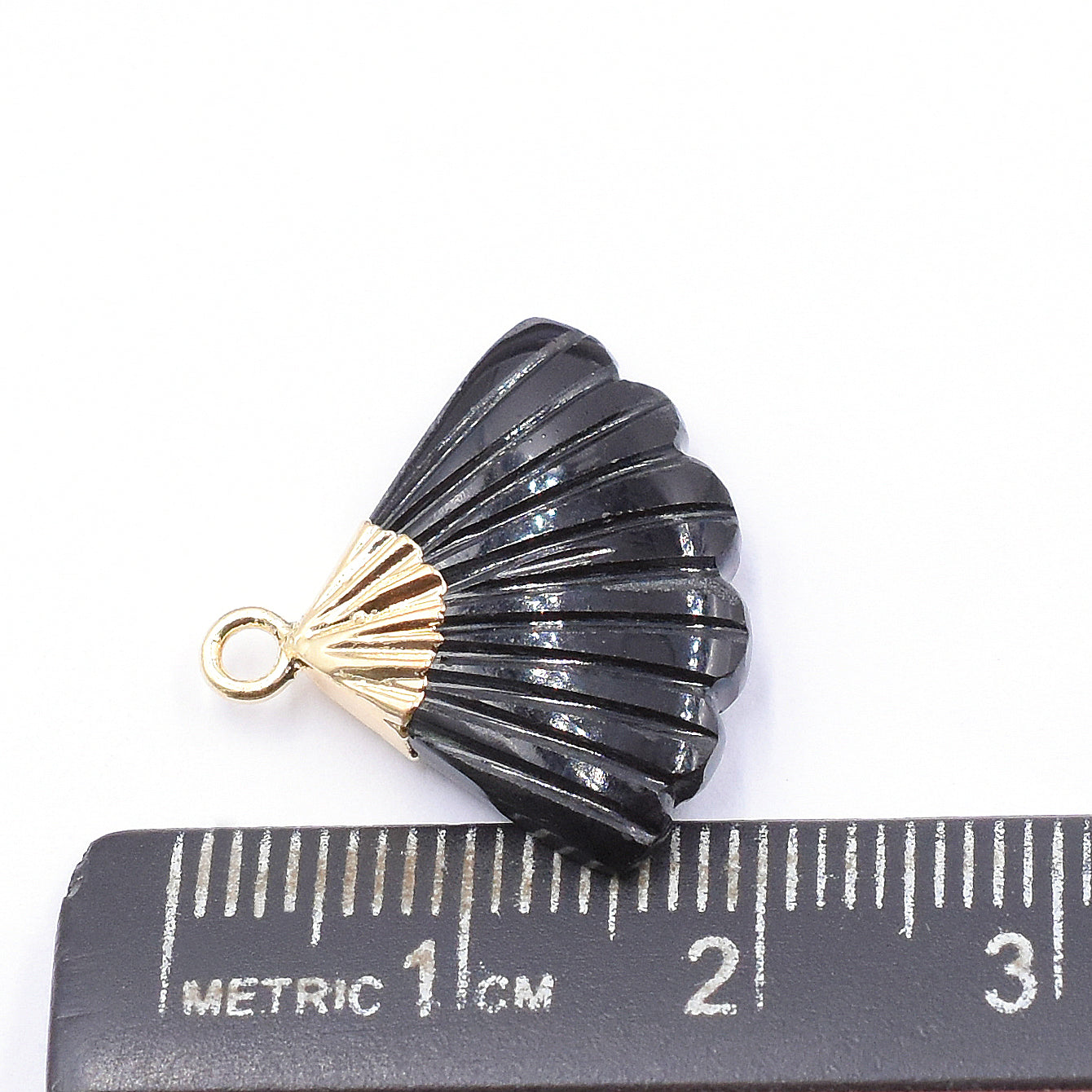 Feather black onyx pendant in gold electroplated setting for a classic look