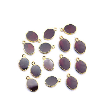 oval shaped Garnet pendant with gold finish