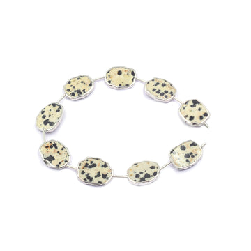 Uneven shaped Dalmatian Jasper pendant with silver finish