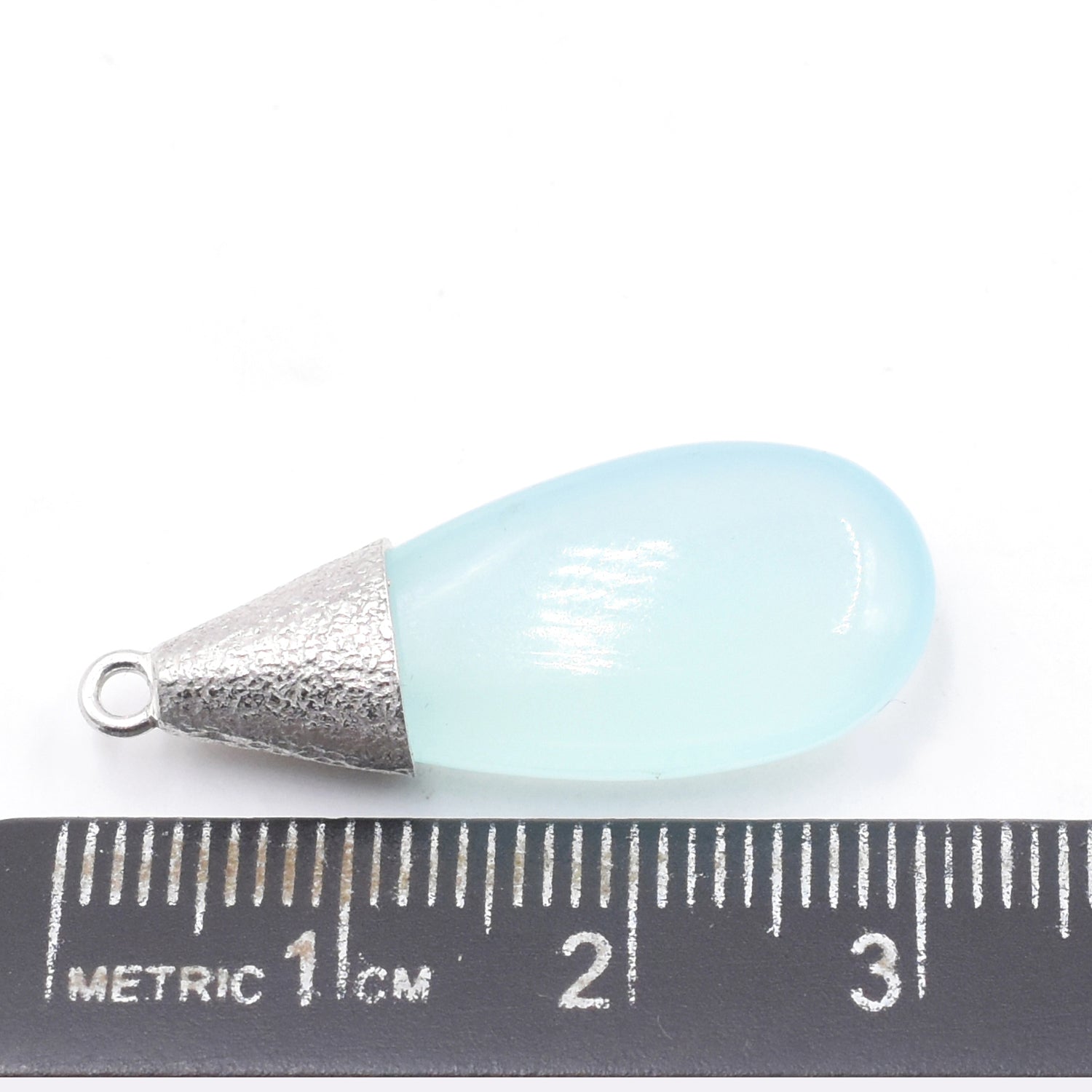 Elongated drop-shaped aqua chalcedony in silver bezel