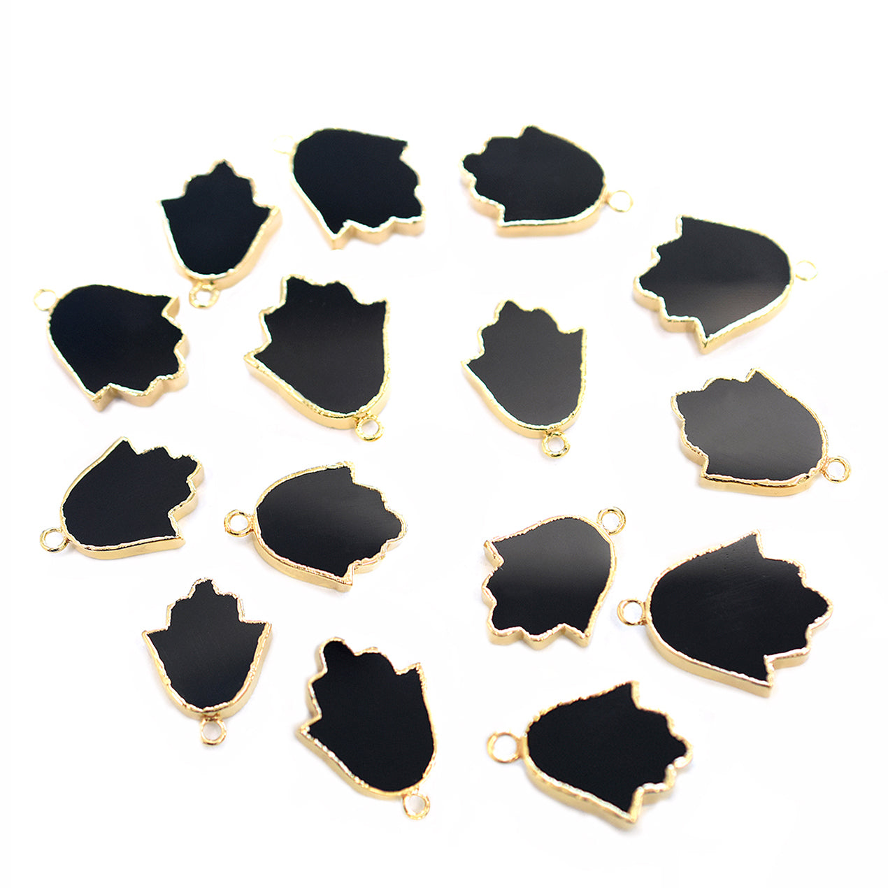 Polished black onyx stone in an oval shape with a gold-plated finish