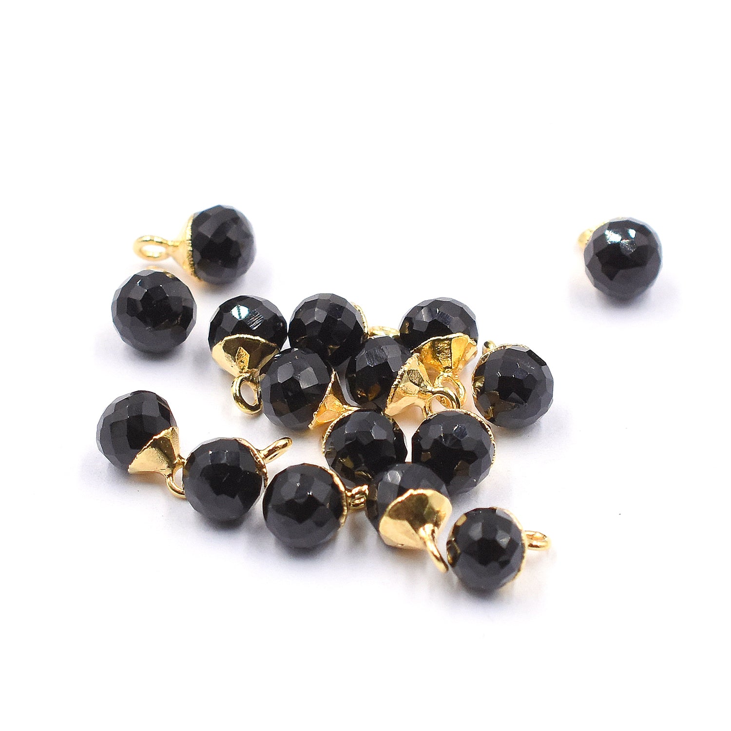 Polished black onyx stone in an Onion shape with a gold-plated finish