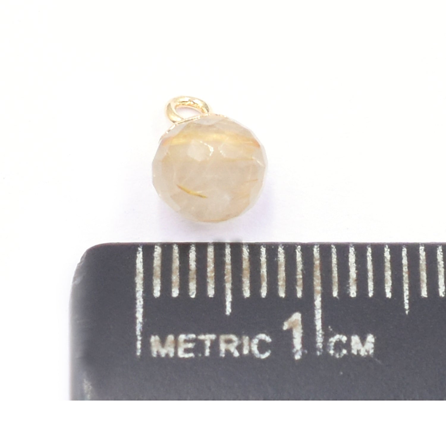 Close up of Onion Shape Golden Rutilated Quartz Pendant with gold Finish