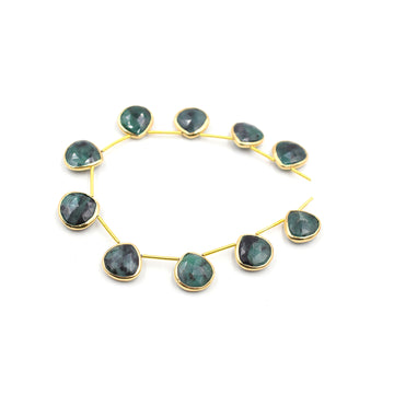 Raw emerald heart gemstone in silver vermeil bezel