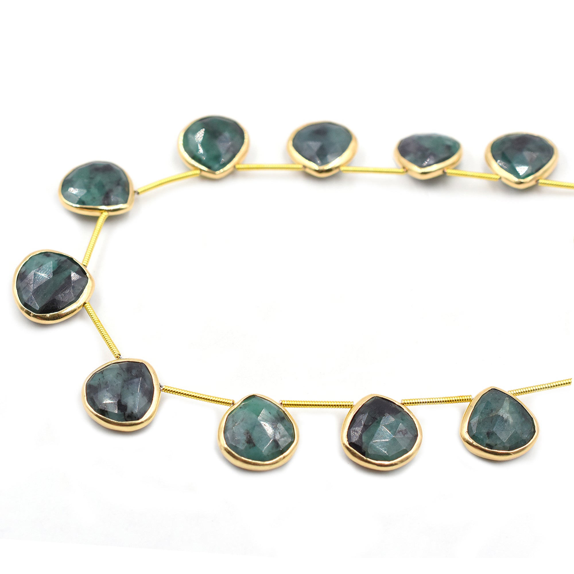 Heart-shaped raw emerald set in silver vermeil