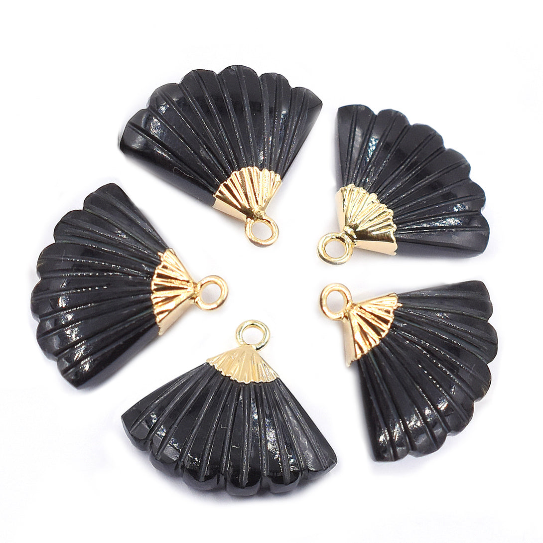 Polished black onyx stone in an Feather shape with a gold-plated finish