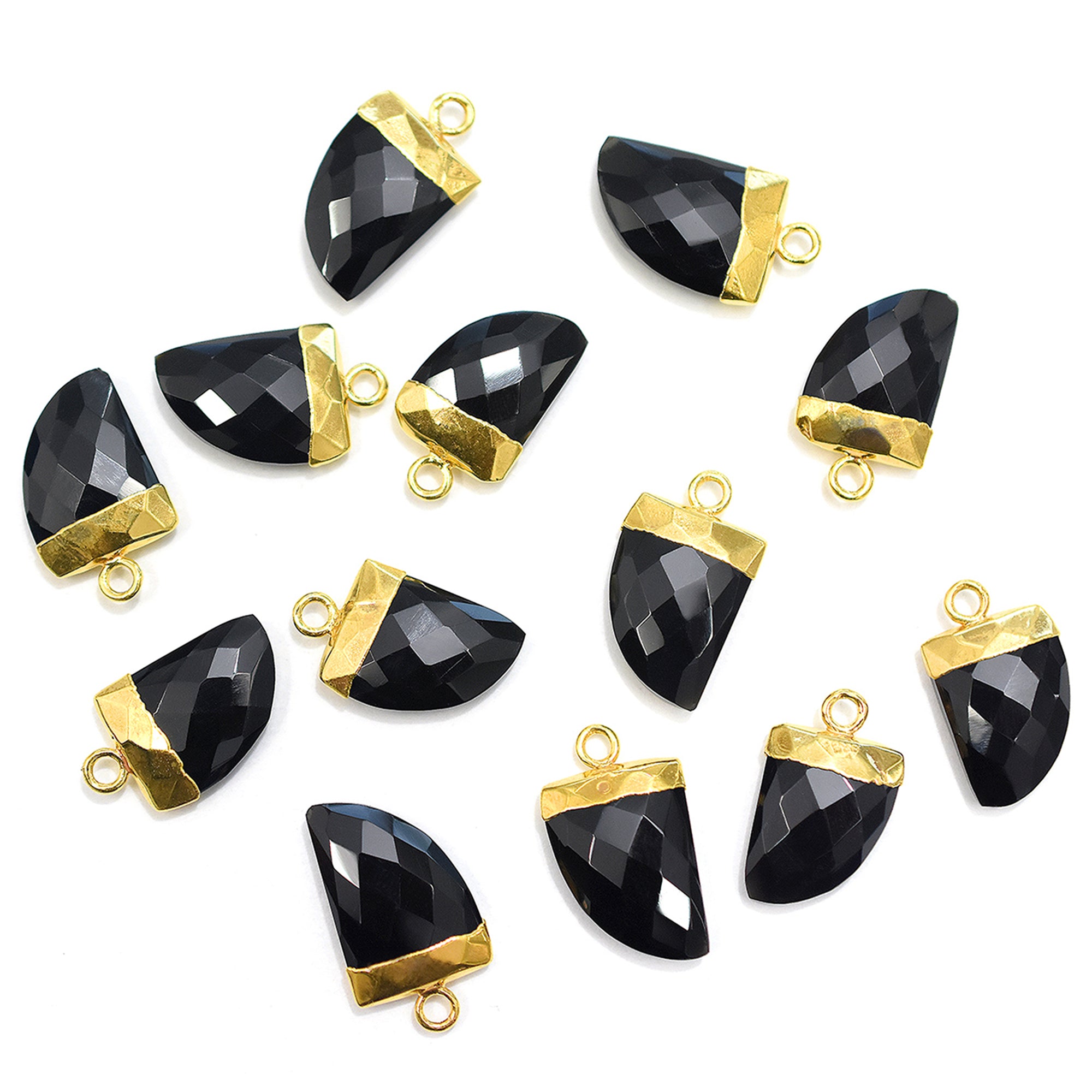 Polished black onyx stone in an horn shape with a gold-plated finish