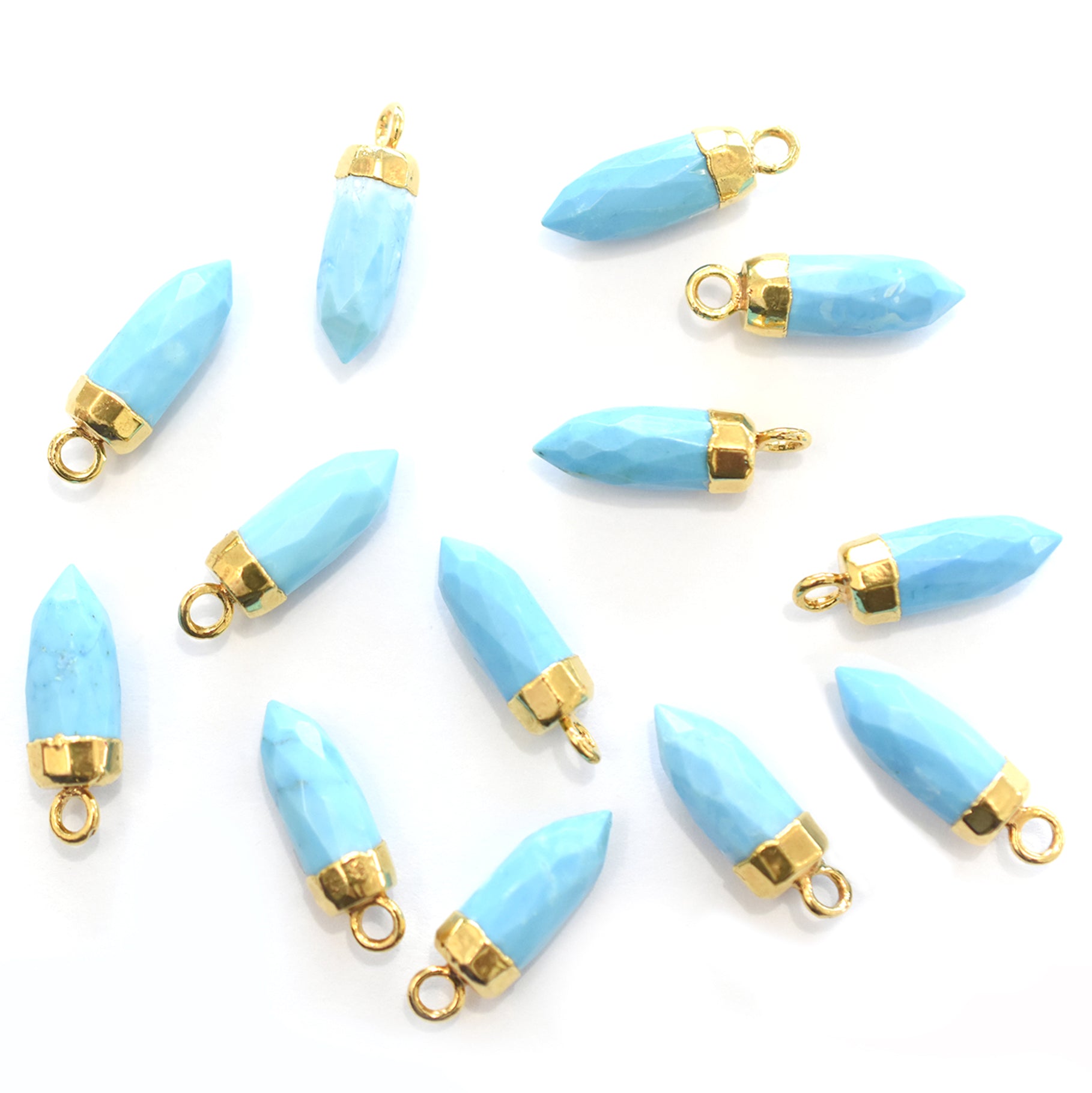 Howlite bullet shaped pendant with gold finish