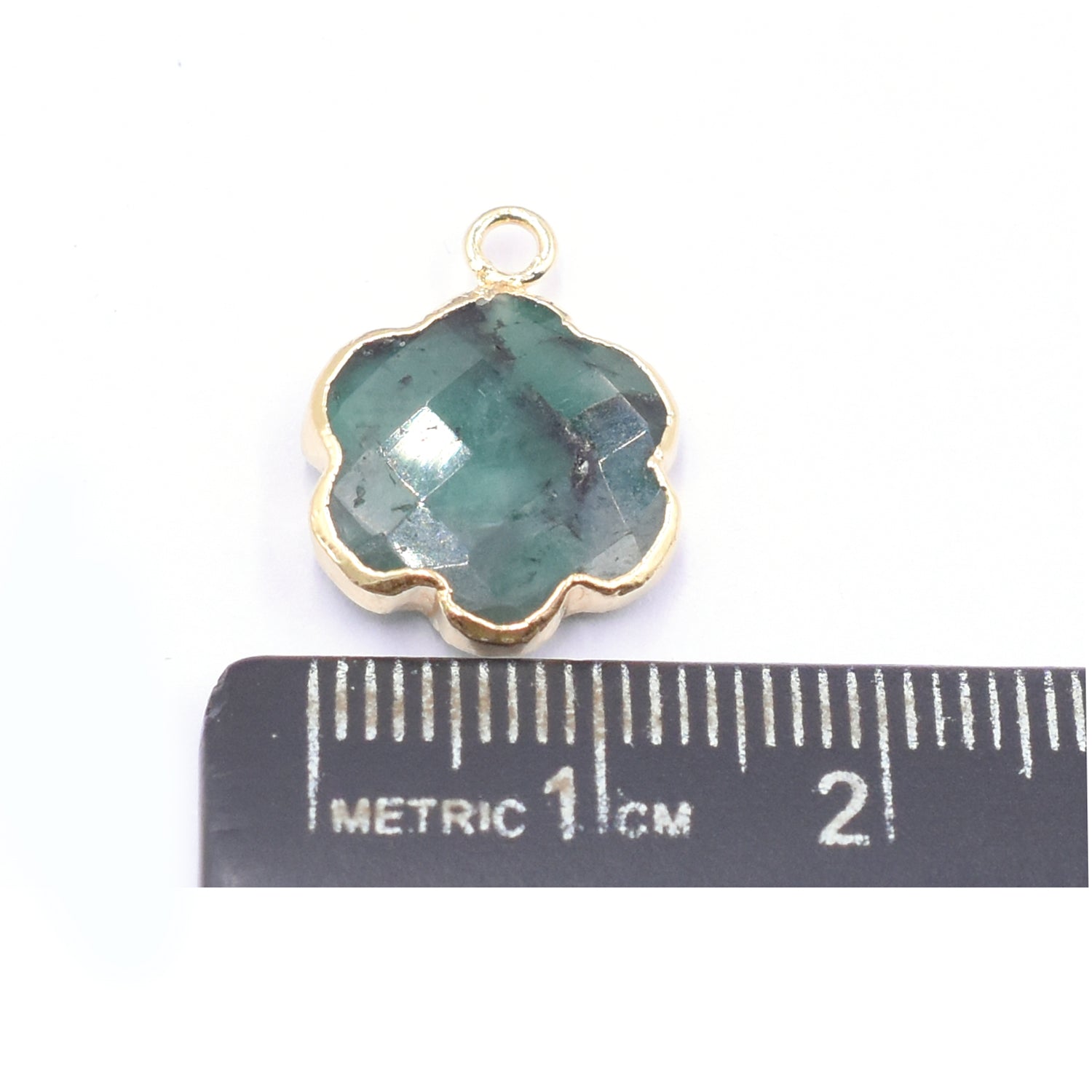 natural leaf pendant in gold with emerald stone